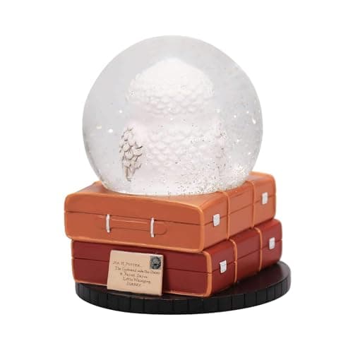 Bola de Nieve de Hedwig junto a su caja