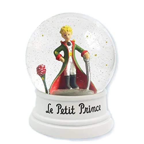 Bola de nieve de El Principito con su traje de gala verde y su rosa, entre estrellas doradas