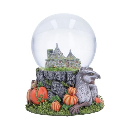 Bola de nieve con la cabaña de Hagrid en miniatura y Buckbeak sentado entre calabazas