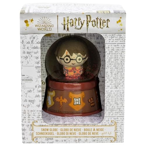 Bola de Nieve de Harry Potter junto a su caja