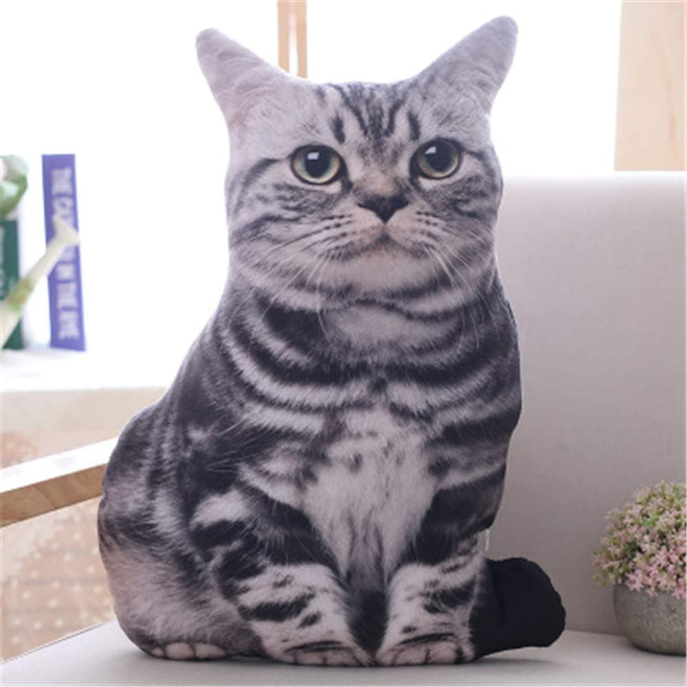 Cojín decorativo con forma de gato sobre un sofá