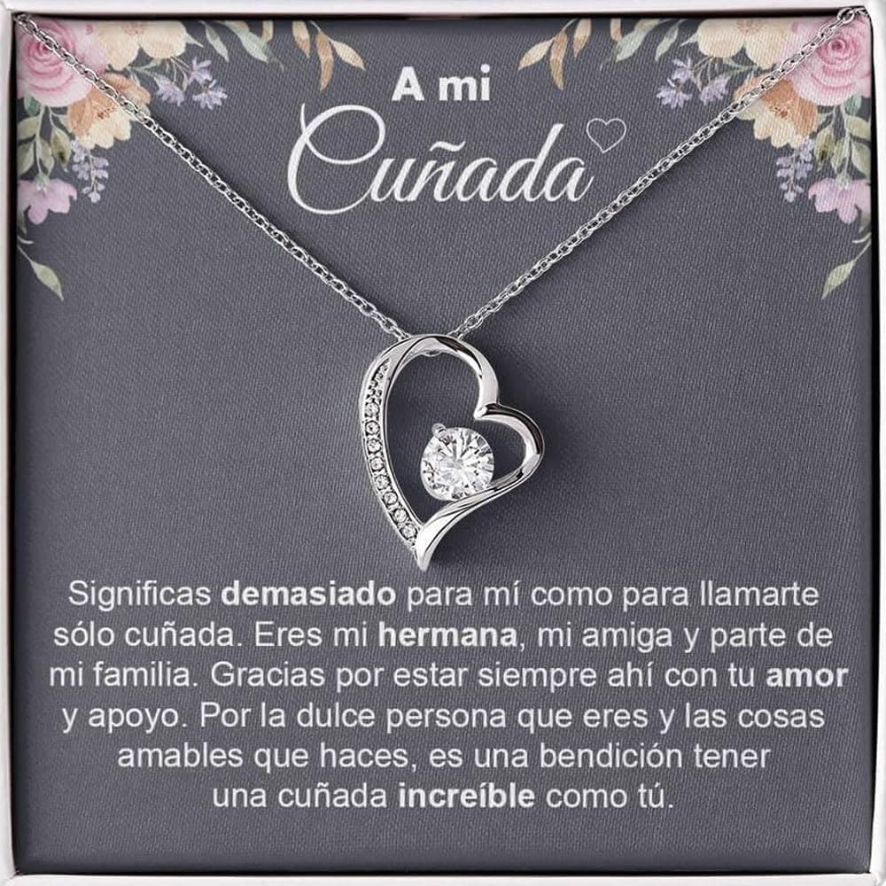 Collar con colgante de corazón y circonita central, presentado en un estuche con la tarjeta "A mi cuñada" y una dedicatoria impresa