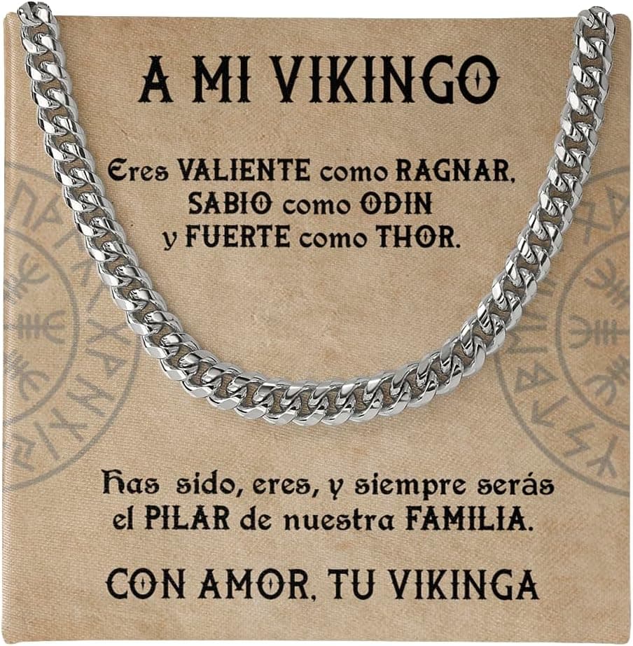 Cadena cubana de acero plateado sobre una tarjeta impresa con una dedicatoria