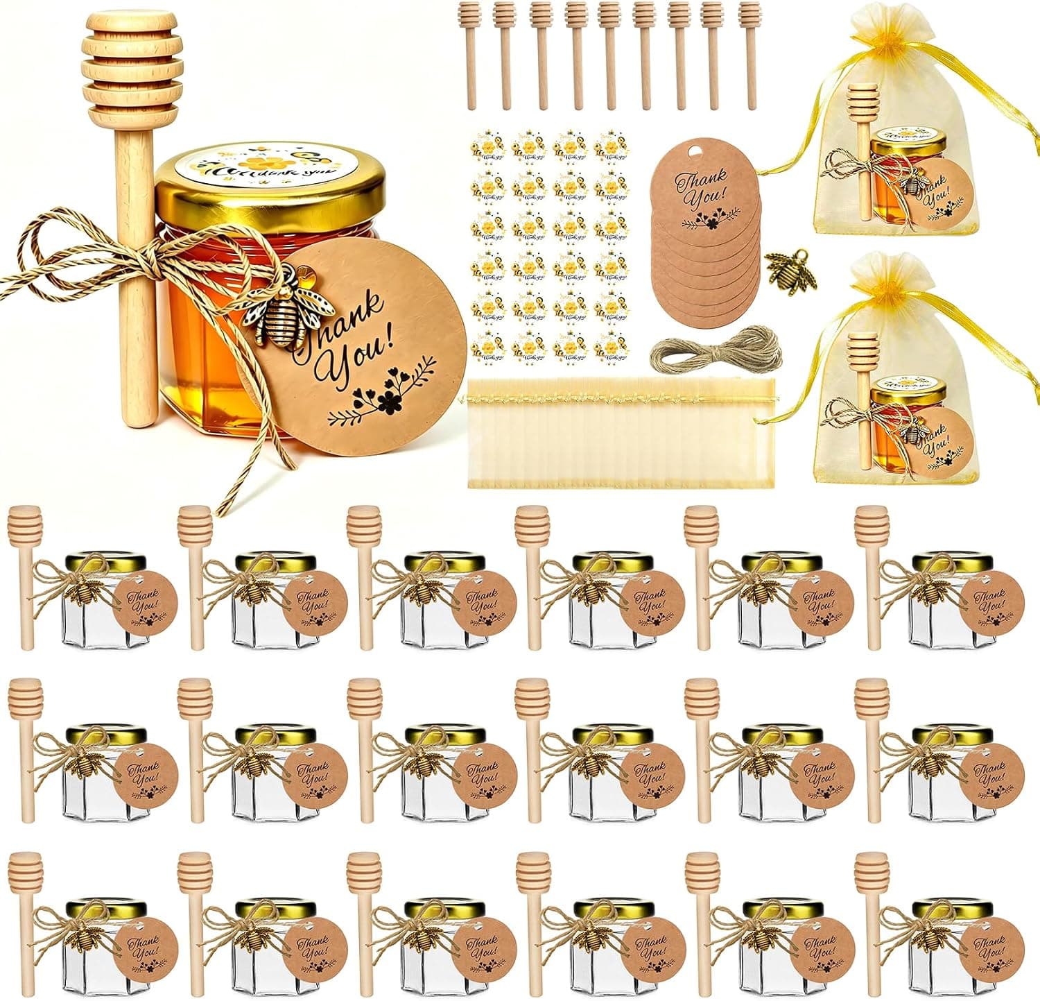 Veinte tarros de miel de cristal con tapa dorada, cucharilla de madera, tarjeta «Thank You», pegatina de abeja y bolsa de organza dorada, junto a un tarro central con lazo y colgante de abeja