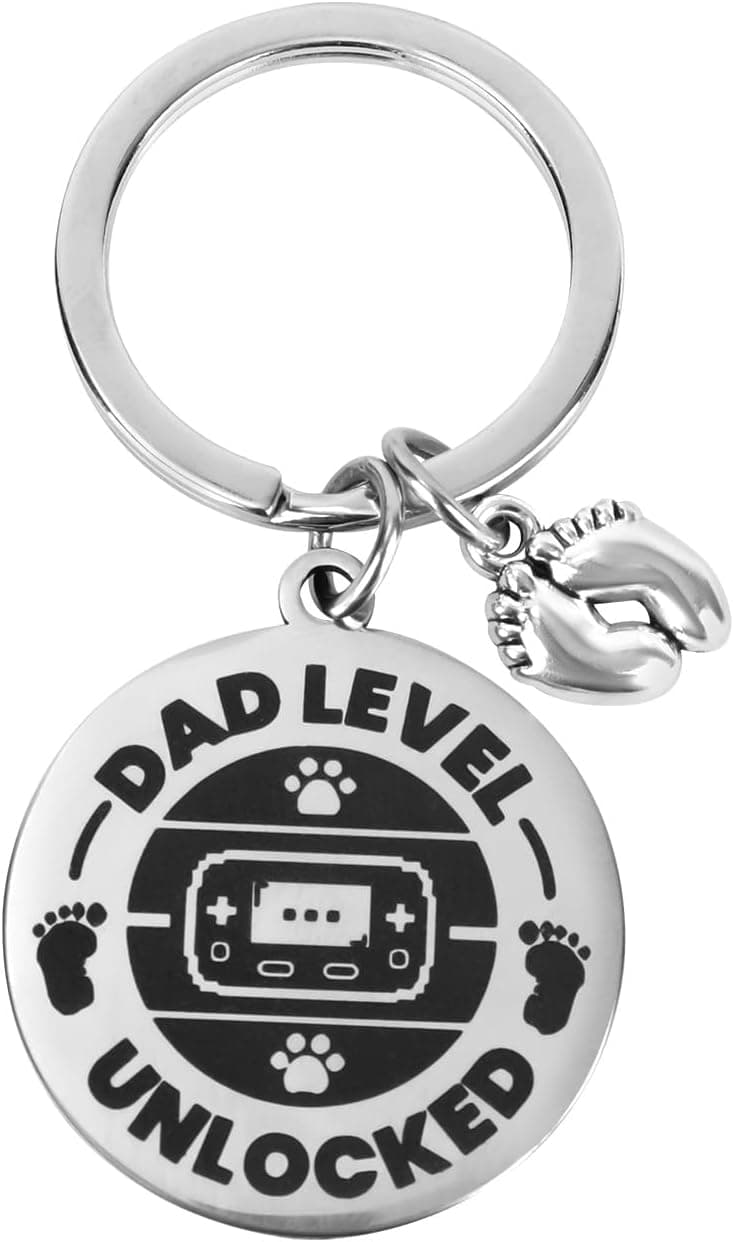 Llavero con diseño de mando de videoconsola y huella de bebé para anunciar el embarazo
