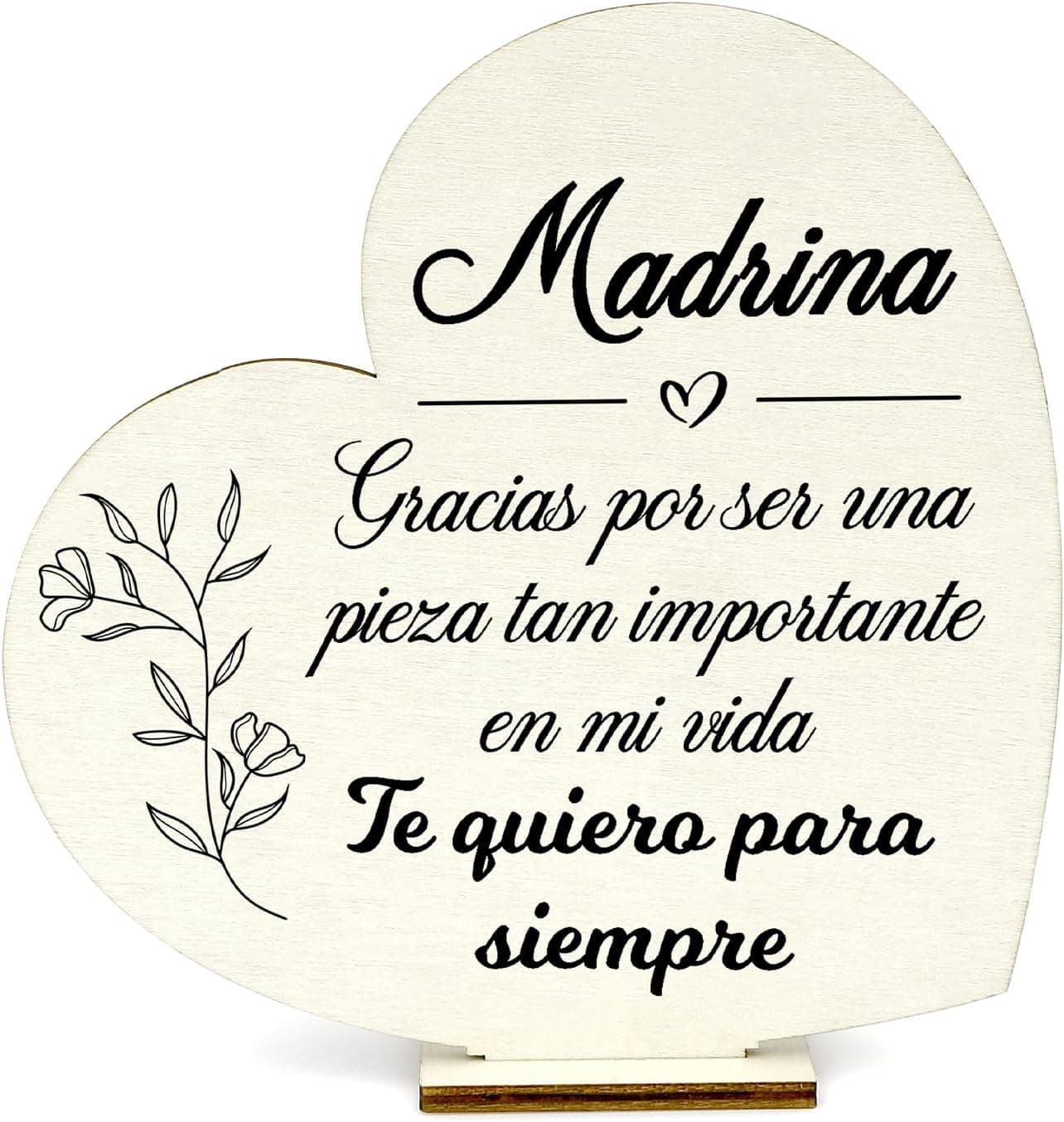 Corazón de madera clara apoyado en una peana, impreso en negro con «Madrina» en letra caligráfica, la frase «gracias por ser una pieza tan importante en mi vida, te quiero para siempre» y una rama de flores dibujada a un lado