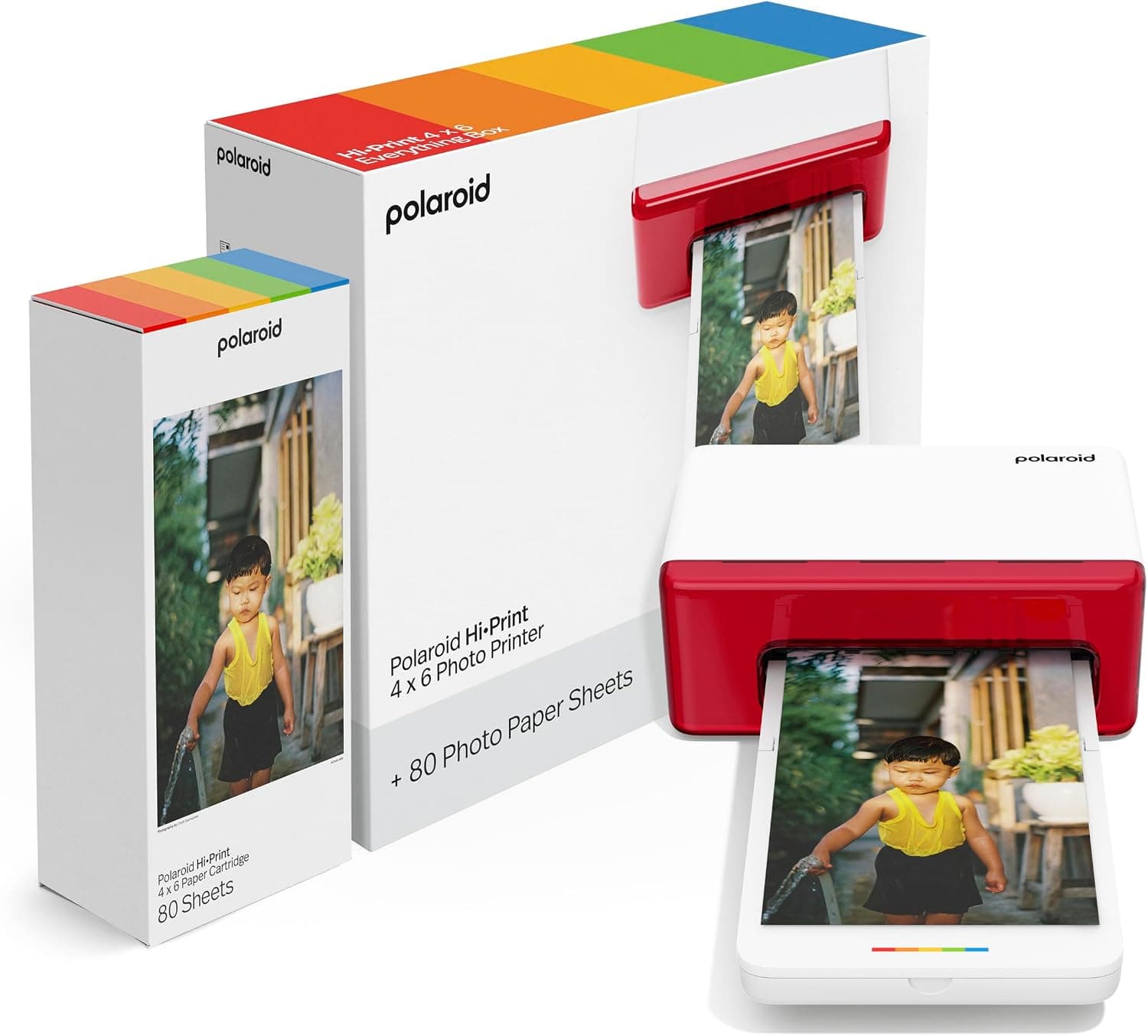 Caja de la Polaroid Hi-Print 4x6 junto al cartucho de papel y la impresora blanca con banda roja