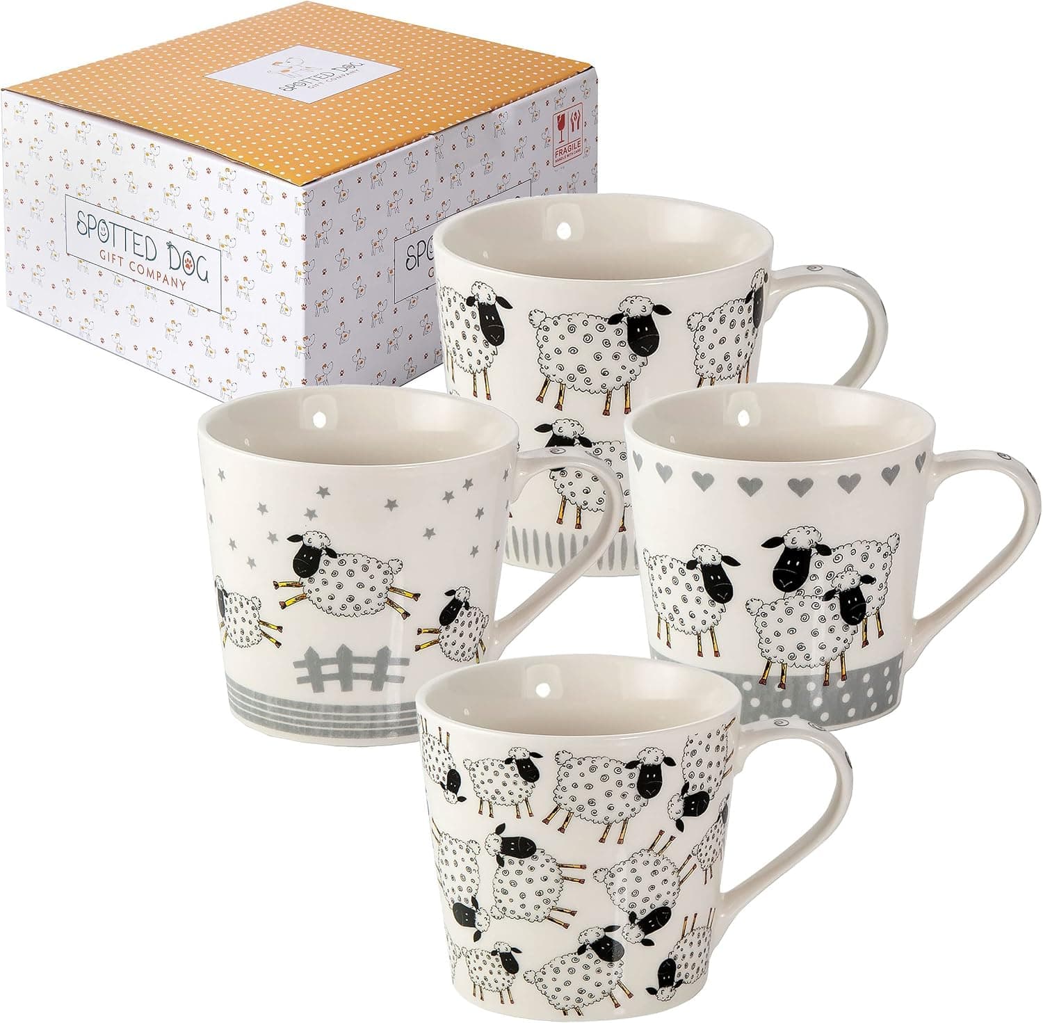 Las cuatro tazas blancas con ovejas dibujadas en distintas escenas: saltando una valla, entre estrellas, en manada
