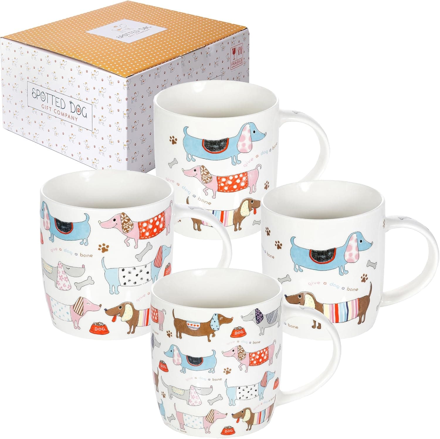 Las cuatro tazas con distintos perros salchicha ilustrados, junto a su caja de regalo con lunares