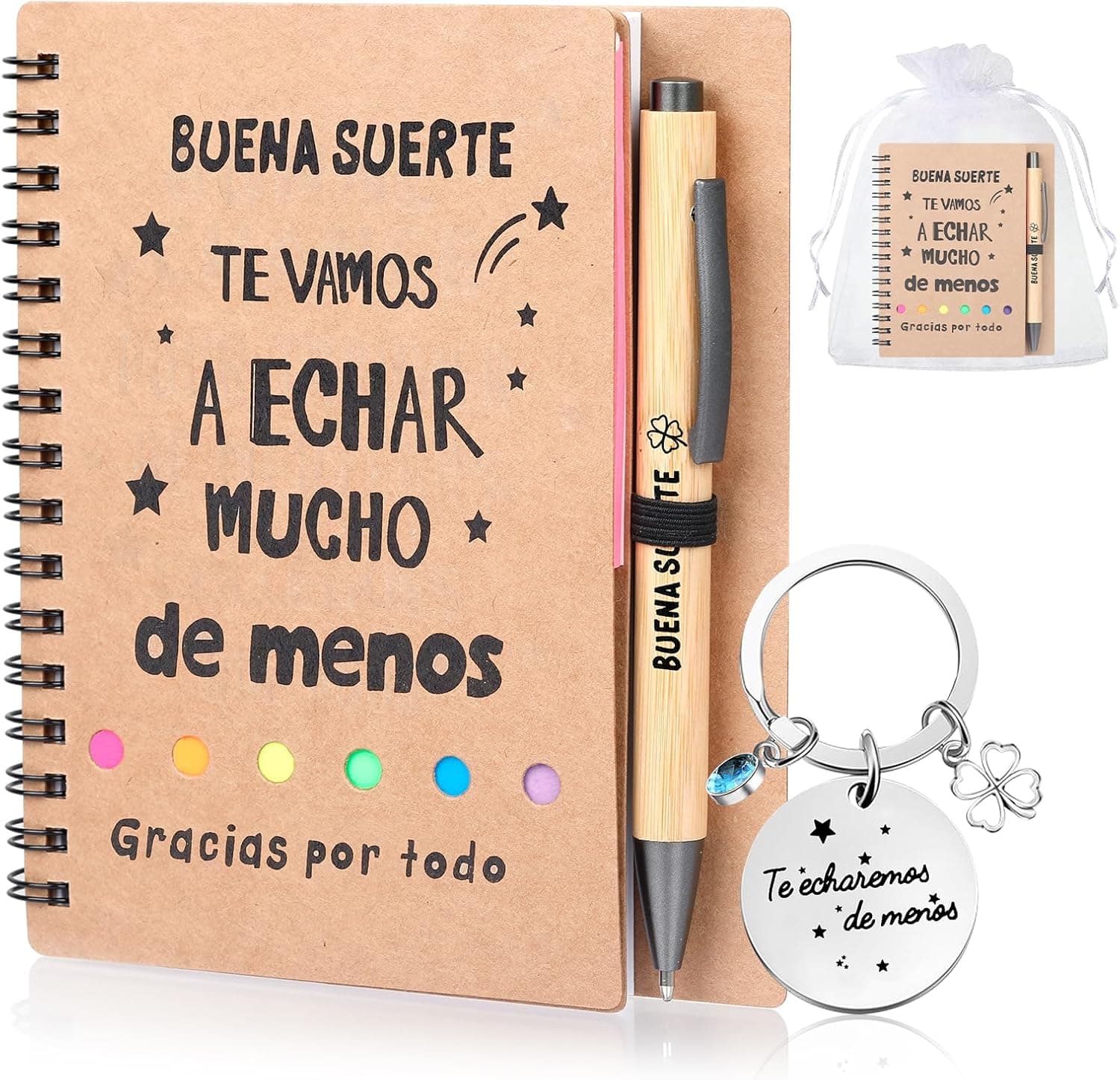 Una mano sostiene el cuaderno abierto, con el detalle de la espiral, las pestañas de colores y el bolígrafo sujeto en su anilla