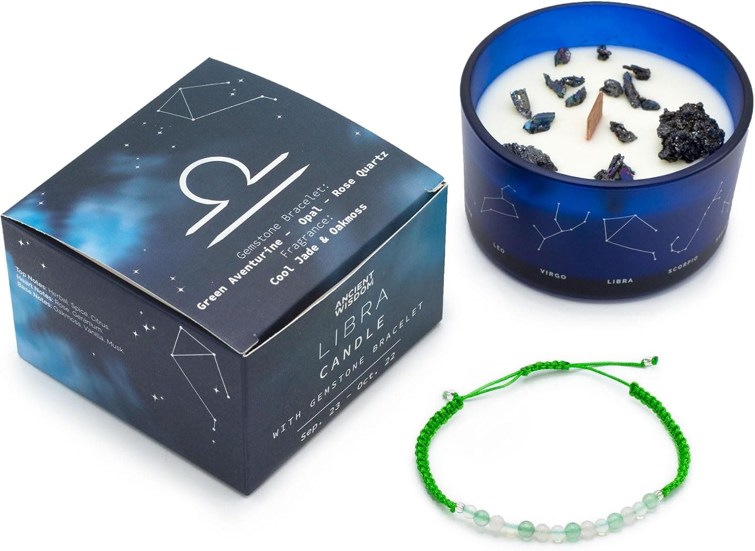 Caja azul con las constelaciones del zodiaco, vela con piedras de cuarzo incrustadas y pulsera de cuentas verdes y blancas de piedras semipreciosas