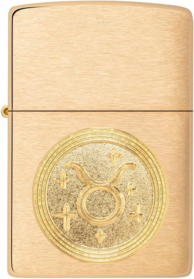 Encendedor Zippo con emblema dorado de Tauro sobre latón cepillado