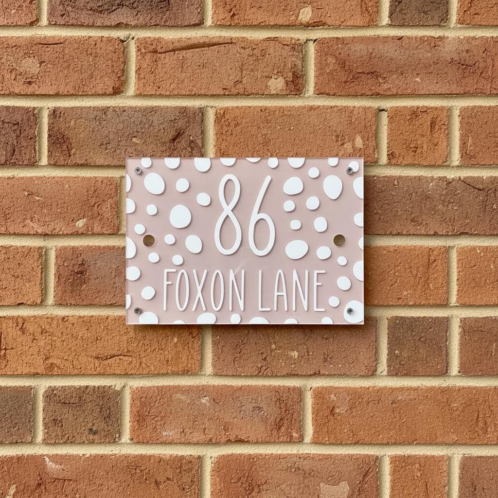 Modern address plaque featuring decorative pattern and clear lettering