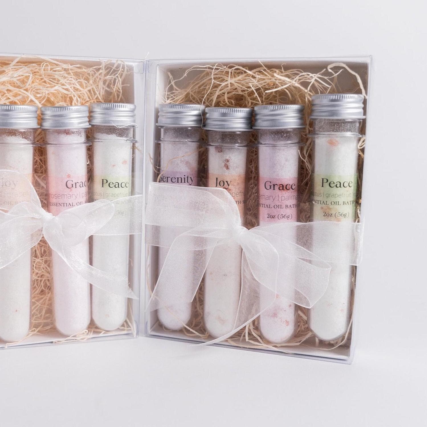 Handmade essential oil bath soak gift set from Megan’s Pantry includes four 2 oz tubes in signature scents: Serenity, Joy, Grace, and Peace. Made with natural salts and organic essential oils, beautifully packaged in a kraft gift box with pine shred and ribbon. Perfect spa-inspired gift for birthdays, showers, or relaxing self-care rituals.