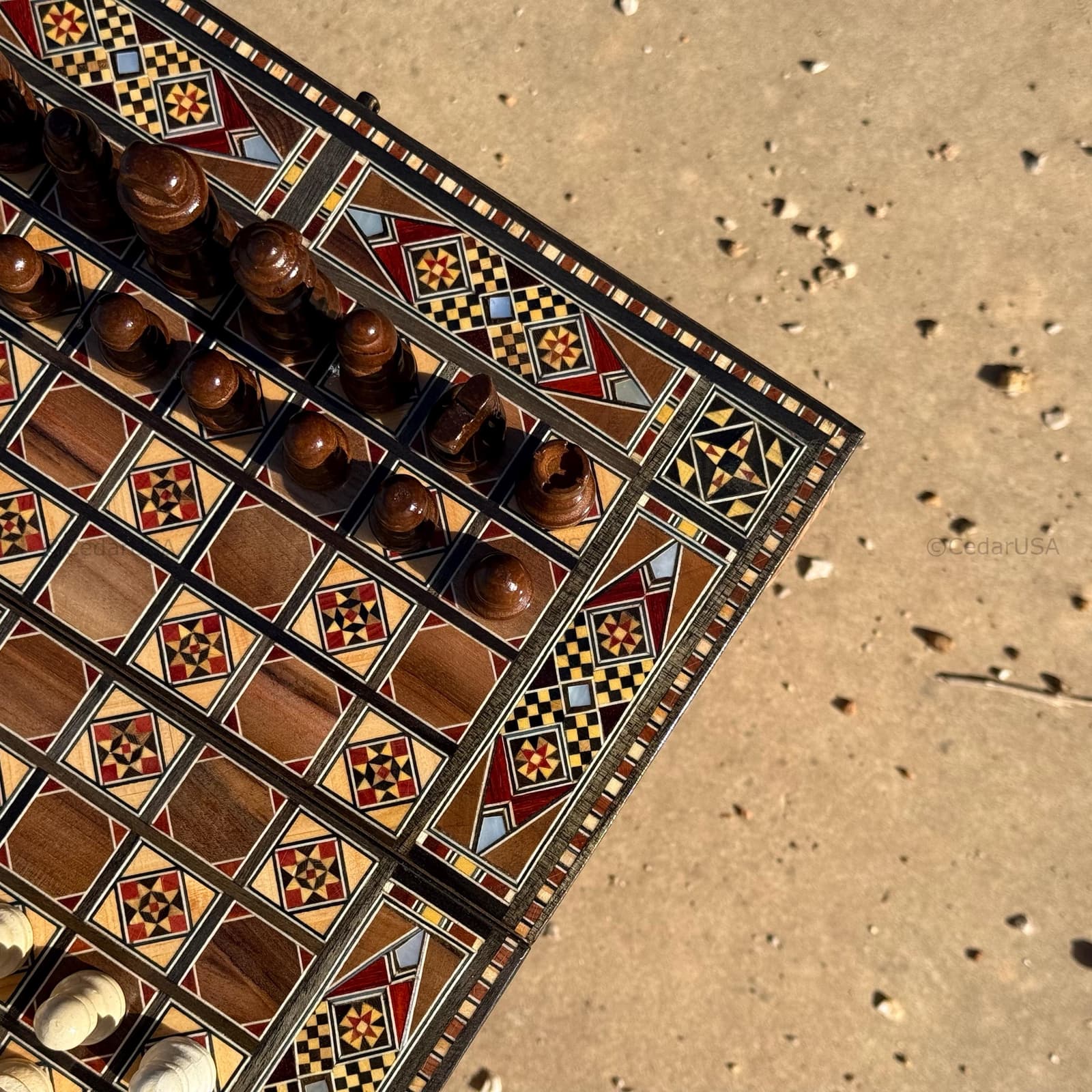 This exquisite Lebanese chess and backgammon set is a masterpiece of traditional craftsmanship. Handmade by skilled artisans, it features real mosaic and genuine pearl inlays, meticulously arranged to create a timeless design. Each detail reflects Lebanon’s rich artistic heritage, combining beauty with durability. The board opens to reveal a smooth backgammon surface inside, making it both elegant and functional a true collector’s piece and a stunning example of authentic Middle Eastern artistry