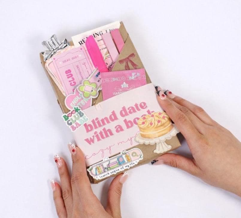 Kindle mystery box displayed as blind date with an ebook and blind date with a book kindle concept, featuring digital book bundle presentation, book gift box styling, bookish bundles arrangement, and reader gifts appeal for modern book lovers.