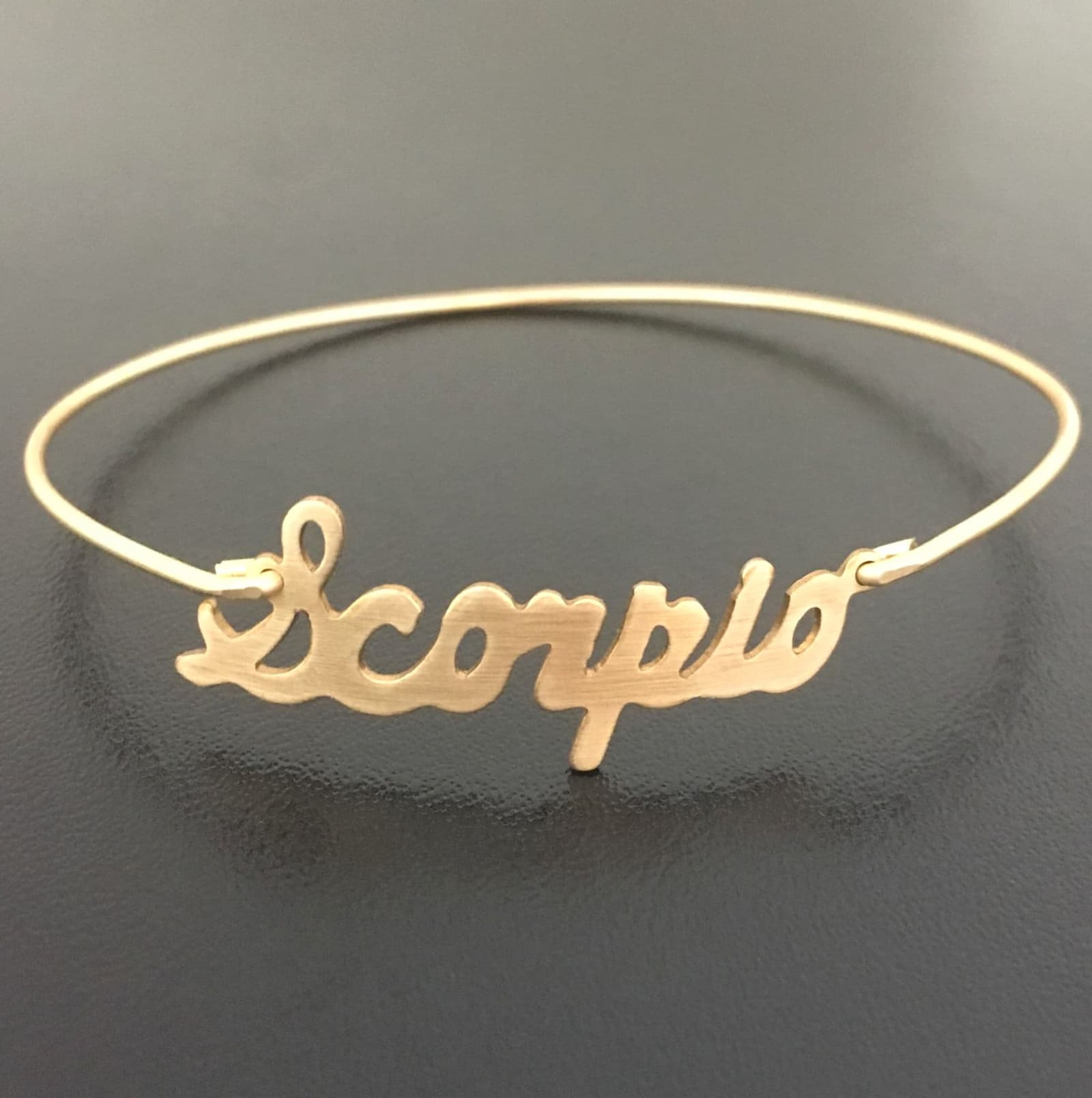 Pulsera rígida fina con signo del zodíaco, foto 5