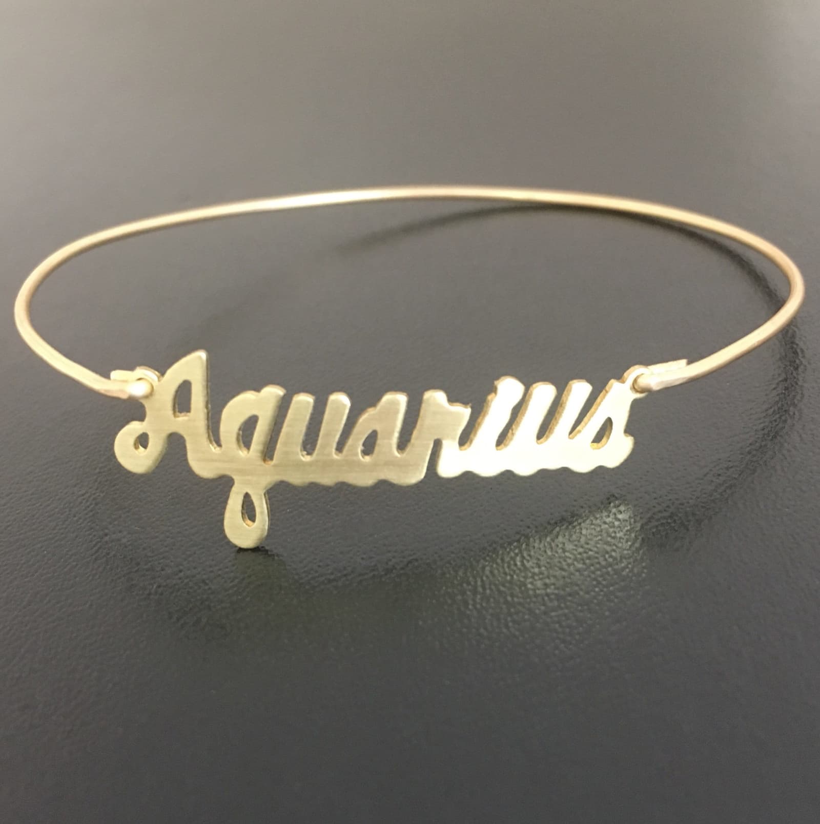 Pulsera rígida fina con signo del zodíaco, foto 7