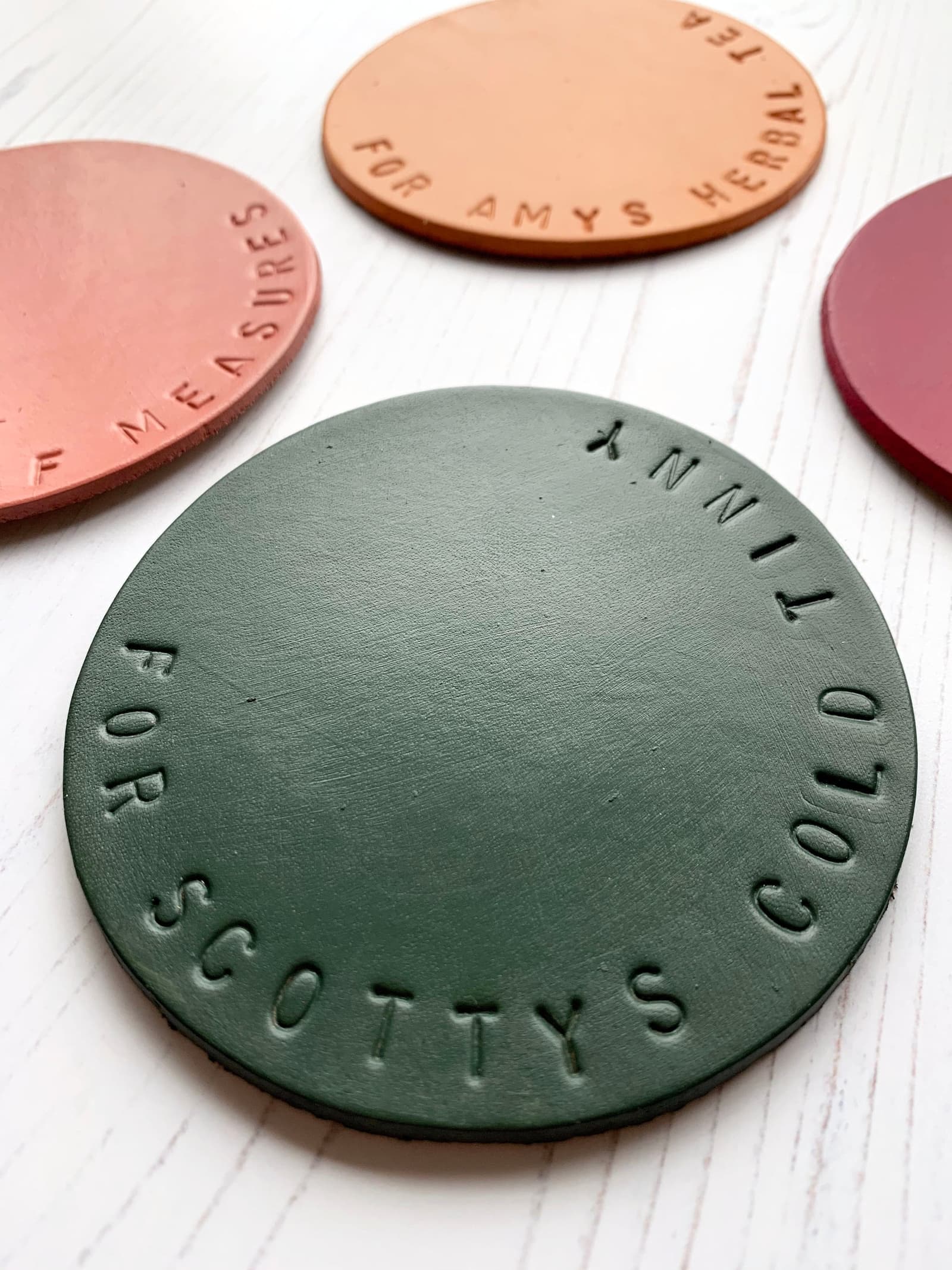 Olive green hand stamped leather coaster, personalised to order