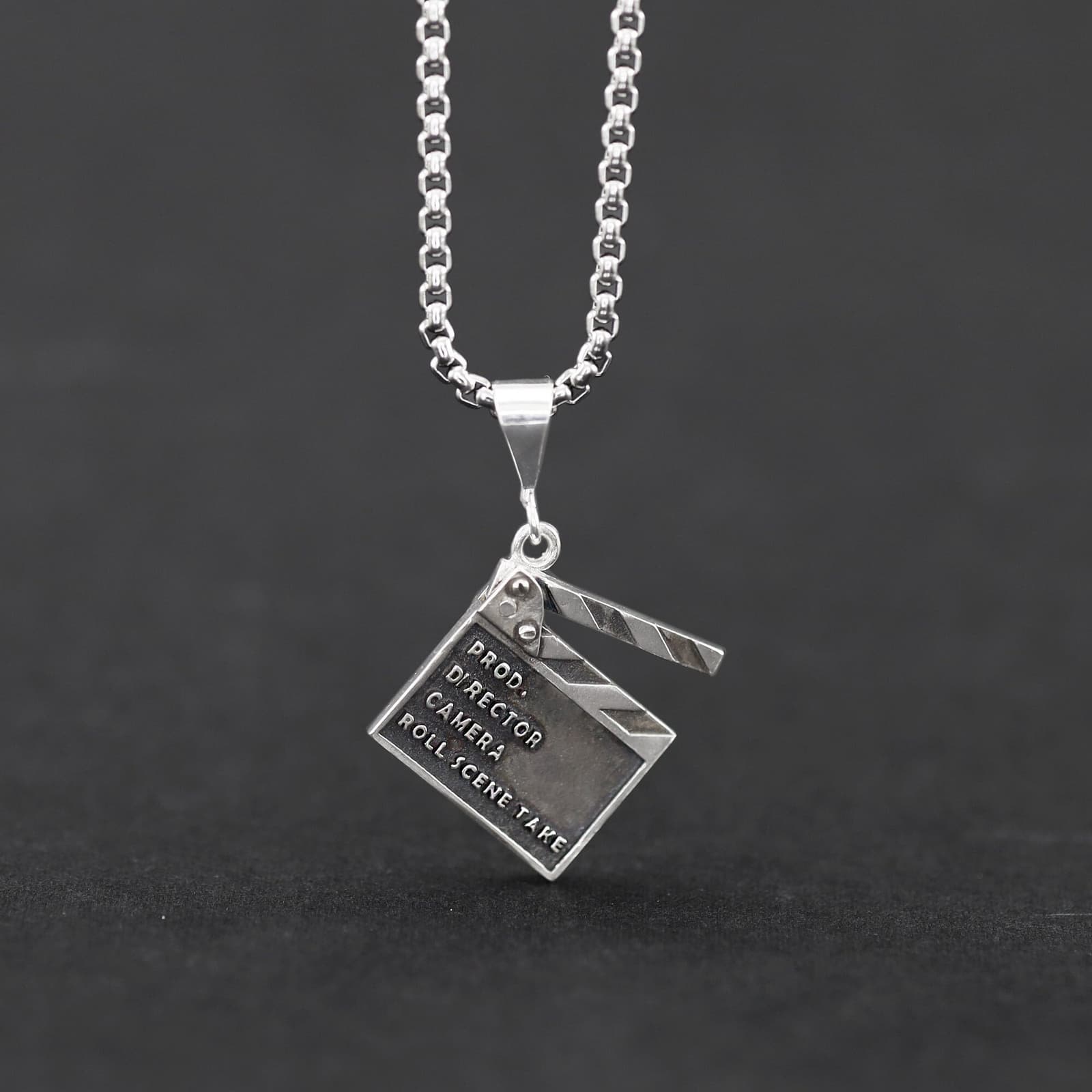 Colgante claqueta de cine en plata