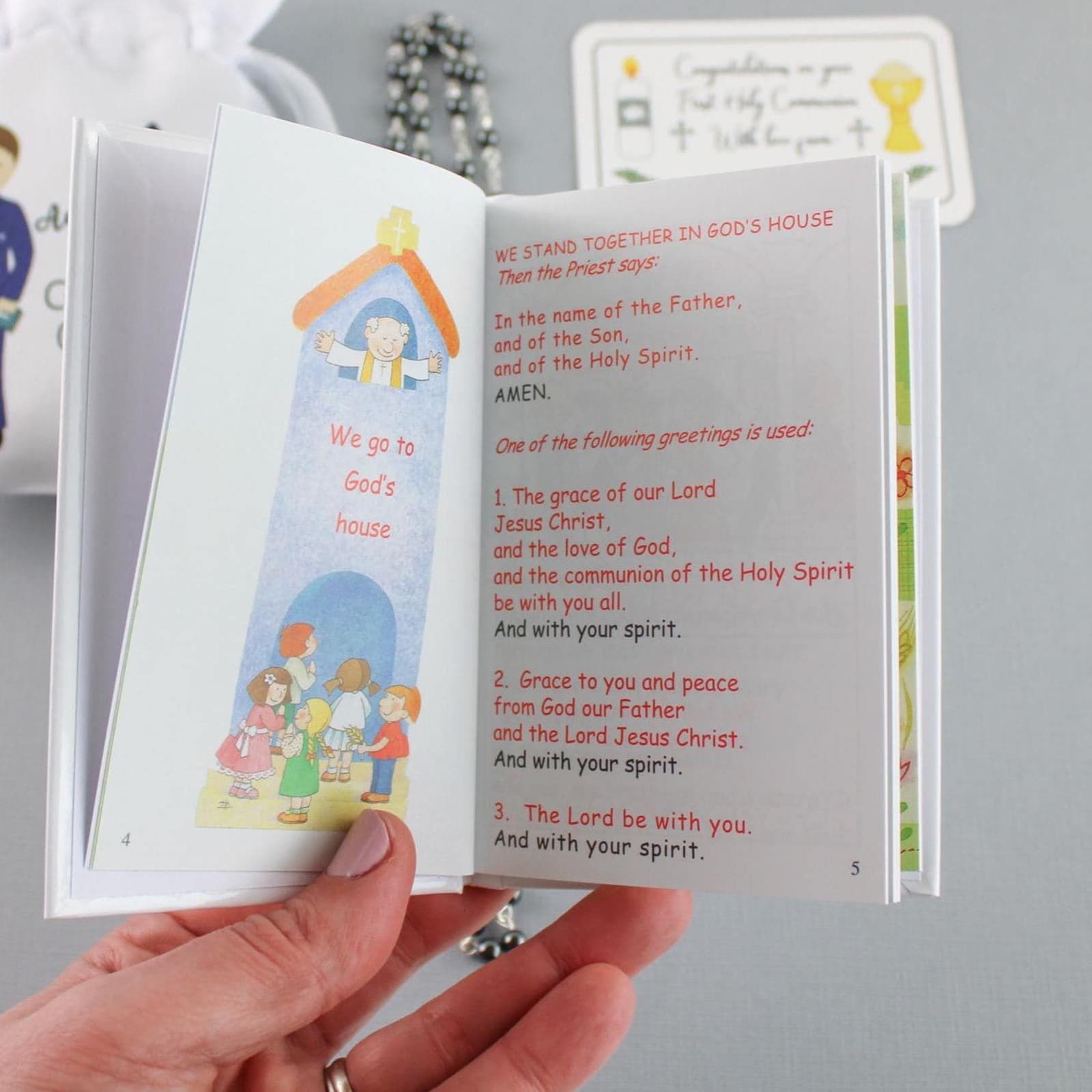 A precious religious themed gift set included with : a personalised white satin pouch bag, a rosary and a little gift tag. With option to add a beautiful. My First Missal book - Remembrance of First Holy Communion.