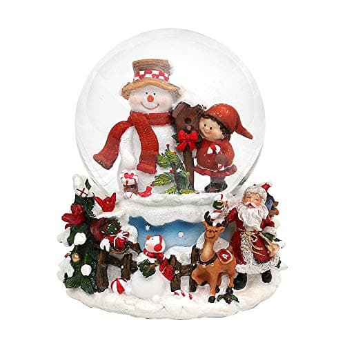 Bola de nieve con muñeco de nieve y un niño, sobre base ornamentada