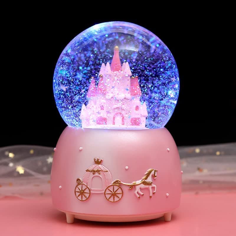 Globo de nieve musical con un castillo 3D dentro y un carruaje de princesa tallado por fuera