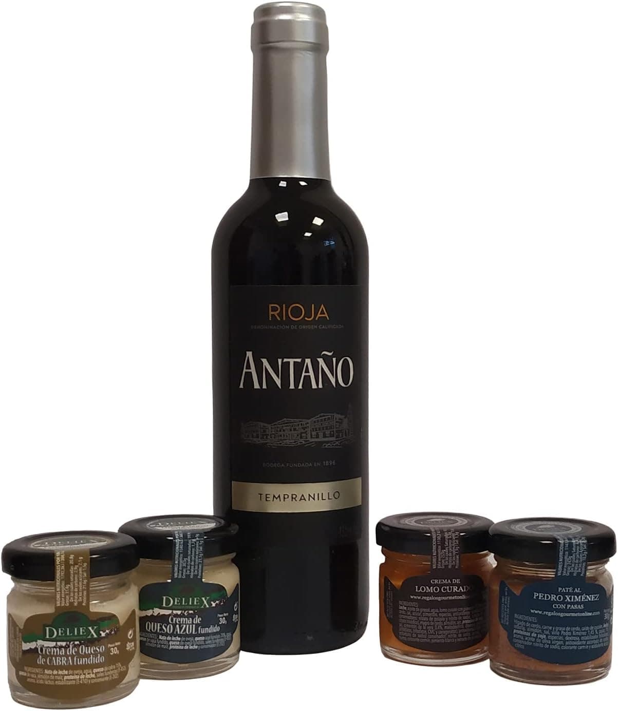 La caja negra abierta con la botella de Rioja tumbada sobre viruta y los cuatro tarritos alrededor