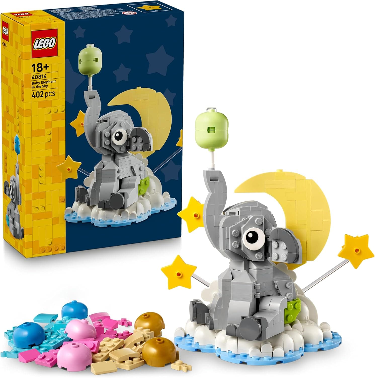 La caja azul del set 40814 junto al elefante gris montado sobre una nube blanca, con la luna amarilla detrás, dos estrellas y un globo verde, y las piezas de globo y pañal sueltas en rosa, azul y dorado